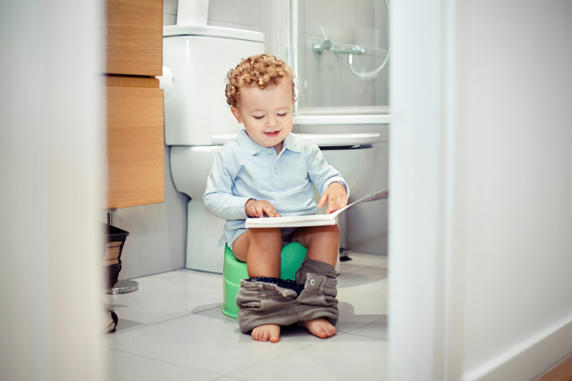 Child sitting on the toilet