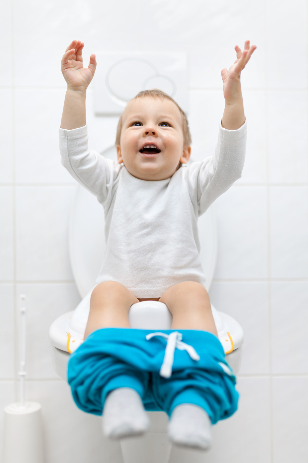 Young Child Sitting on the Toilet